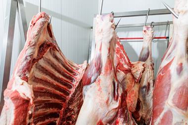 red meat hanging in abattoir
