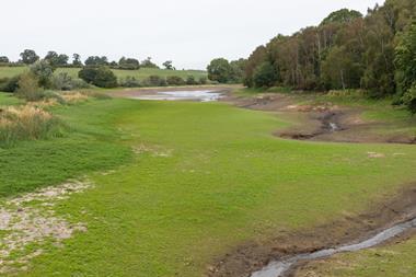 At the end of a dry summer, the water level of Staunton Harold Reservoir is very low, allowing grass to grow over the reservoir bed - The Grocer