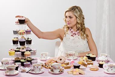 woman eating cake and tea