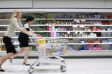 running shopper supermarket trolley aisle