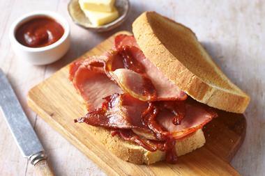 Bacon on bread with knife