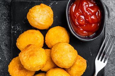 Fried potato balls with ketchup