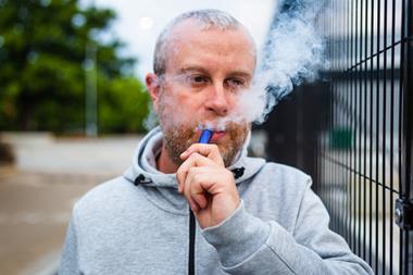 man vaping disposable single use vape