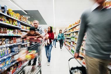 Busy Supermarket Aisle With Customers