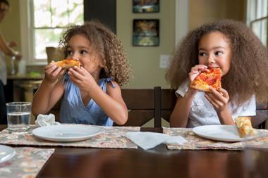 Children eating pizza