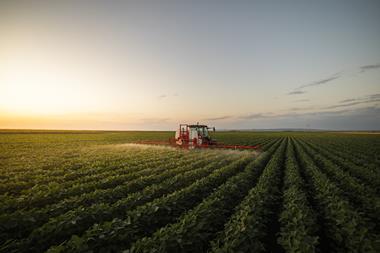 fertiliser sprayed on crops by tractor - getty