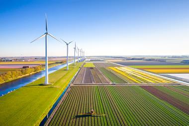farming farm wind turbine sustainable sustainability eco climate change GettyImages-1396844586