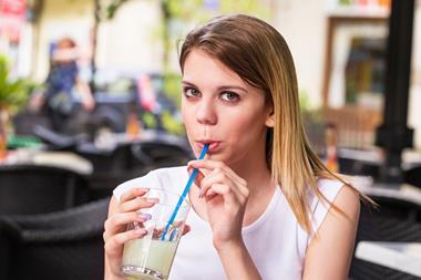woman drinking lemonade soft drink straw