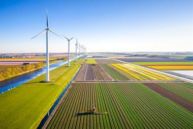 farming farm wind turbine sustainable sustainability eco climate change GettyImages-1396844586