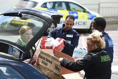 Asda staff distribute food and drink for the victims of the Manchester concert attack