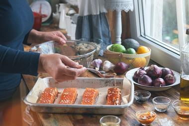 Preparing Spicy Salmon Bowl with Rice, Carrots, Cucumber and Avocado