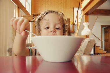 child eating cereal breakfast