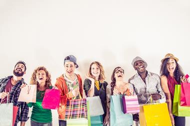 Young people Gen Z millennials with shopping bags high street