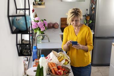 GettyImages_Woman calculating cost of shopping_Credit Sladic