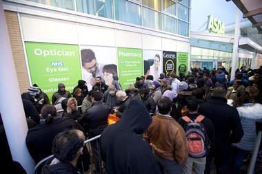 QUEUES OUTSIDE: Crowds of excited shoppers wait outside the Asda store in Wembley for the highly anticipated Black Friday sales. This years offers are 3 x times bigger and better than last year, with double the number of ranges on offer in 441 of its stor