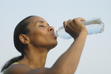 Woman drinking bottled water