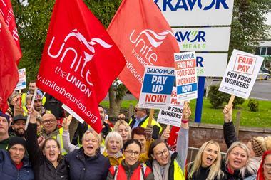 Workers on strike holding signs outside Bakkavor Spalding strike action