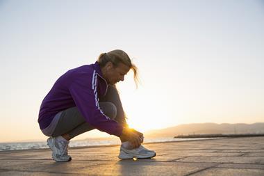 woman tying running shoes