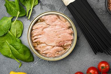 Tuna canned fish seafood, on gray stone table background, top view flat lay - Getty