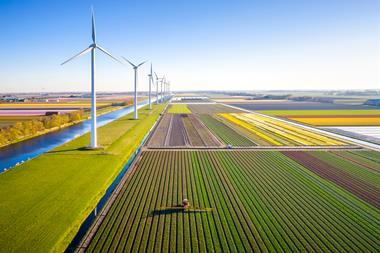 farming farm wind turbine sustainable sustainability eco climate change GettyImages-1396844586