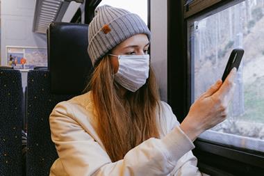 woman in mask on train coronavirus