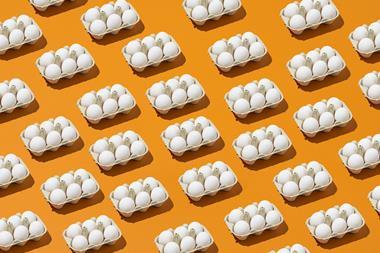Multiple eggs laid in a pattern on a colorful background - Getty Images