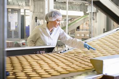 Woman on sweet biscuit production line