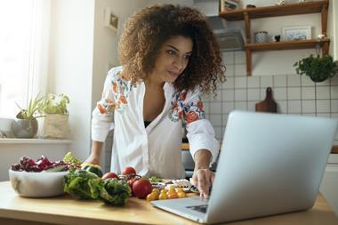 woman cooking laptop computer recipe