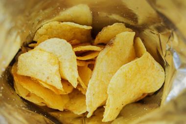 Potato crisps in an open bag