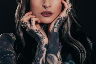 woman with tattoos and piercings