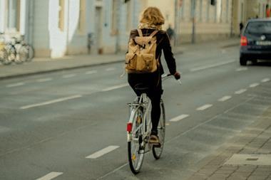 woman bike in town unsplash