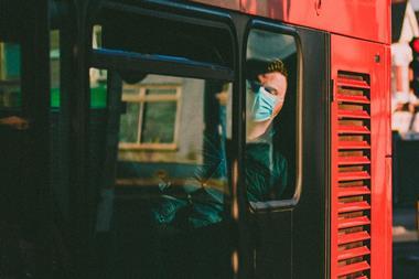 man in mask on bus coronavirus
