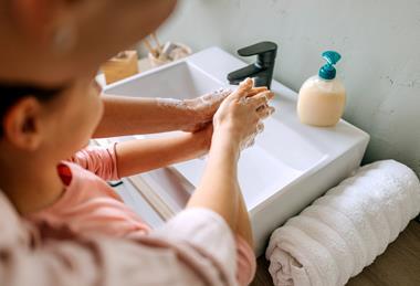 child washing hands