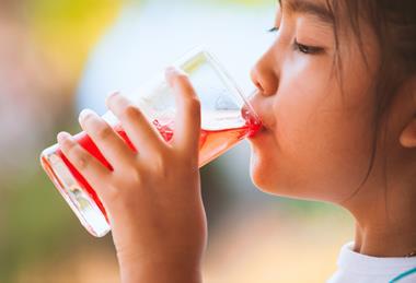 child drinking squash drink