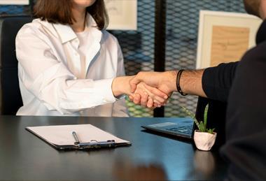 office handshake unsplash