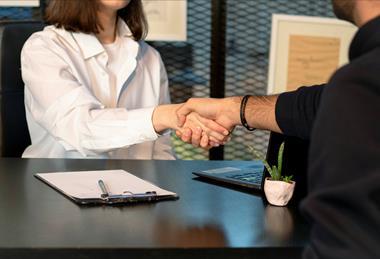 office handshake unsplash