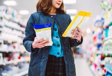 shopper compare household wipes cleaning aisle