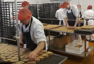 Staff picking up oatcakes cropped