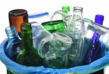 Glass drink bottle in waste