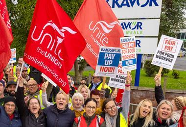 Workers on strike holding signs outside Bakkavor Spalding strike action