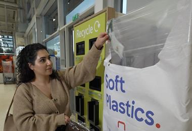 Shopper recycling soft plastic tesco