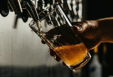 pint of beer pulling unsplash