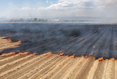 farm field fire wildfire climate global warming GettyImages-1795140803