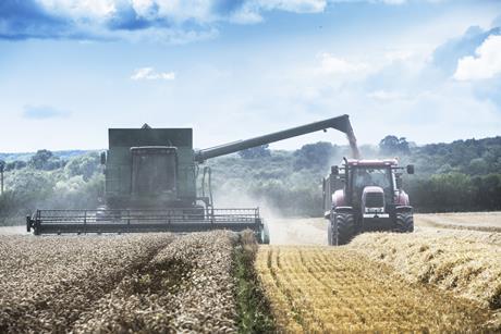comvbine harvestor and tractor - getty