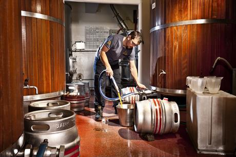 Brewery pouring beer away