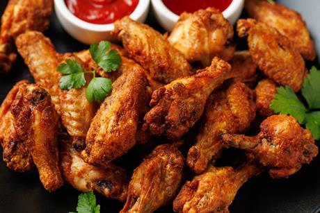 Crispy Chicken Wings with Dipping Sauces. Homemade roasted in the air fryer. - stock photo