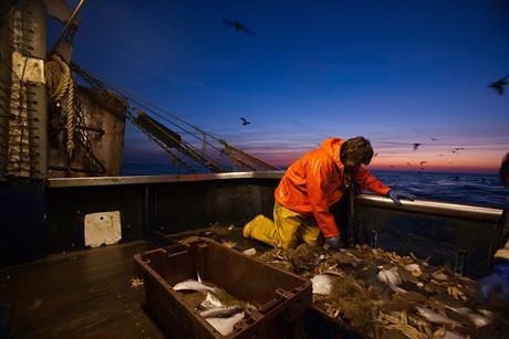 Trawler fishing at night - stock photo