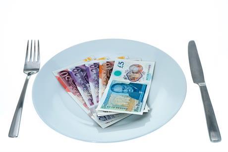 British banknotes on a dinner plate = white background - stock photo
