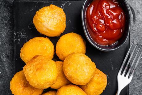 Fried potato balls with ketchup