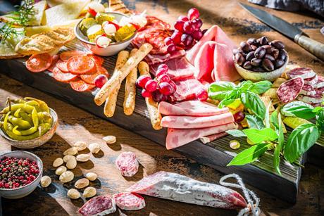 Deli pickles meats charcuterie GettyImages-1565534485